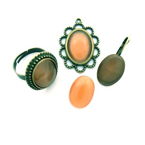 https://www.deida.ro/5192-7585-thickbox/cabochon-sticla-cat-eye-portocaliu-piersica-1813mm.jpg