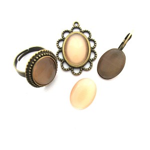https://www.deida.ro/5193-7587-thickbox/cabochon-sticla-cat-eye-portocaliu-caisa-pal-1813mm.jpg